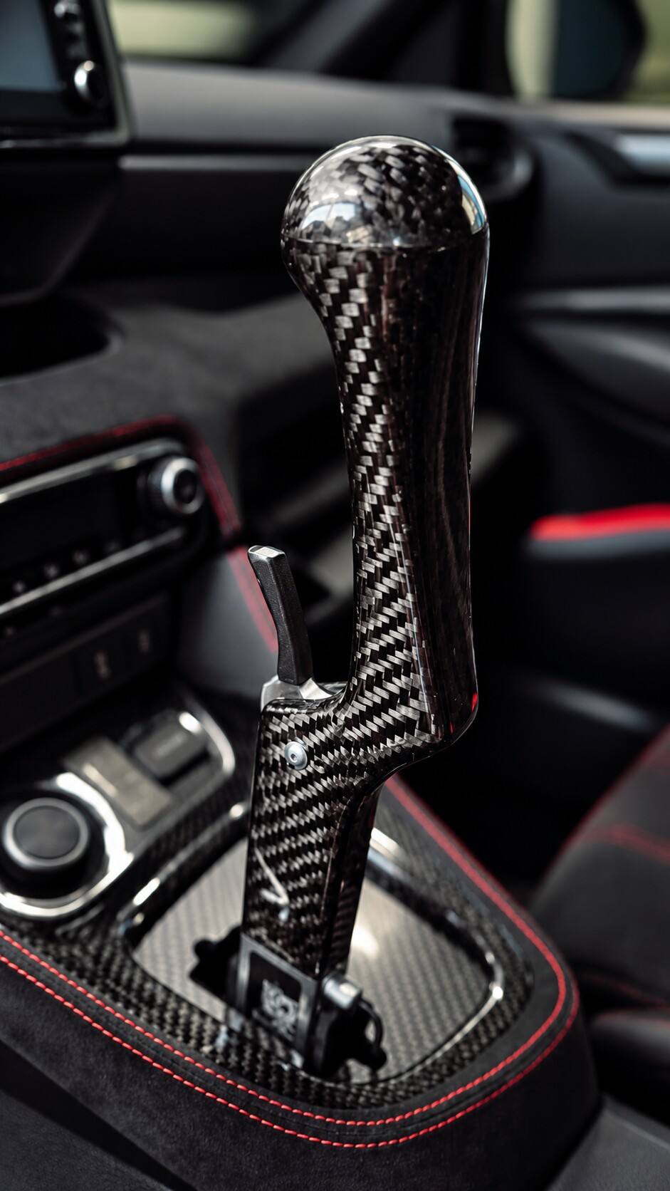 Carbon fibre vertical handbrake in a Toyota GR Yaris