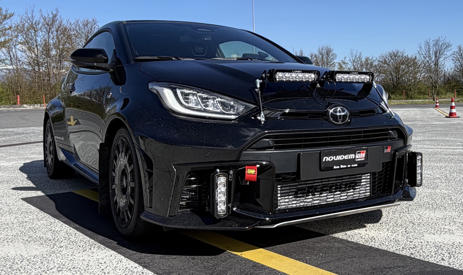 Black GR Yaris competition car prepared by GR Novidem, front three-quarter view